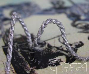 Metallic twisted cord